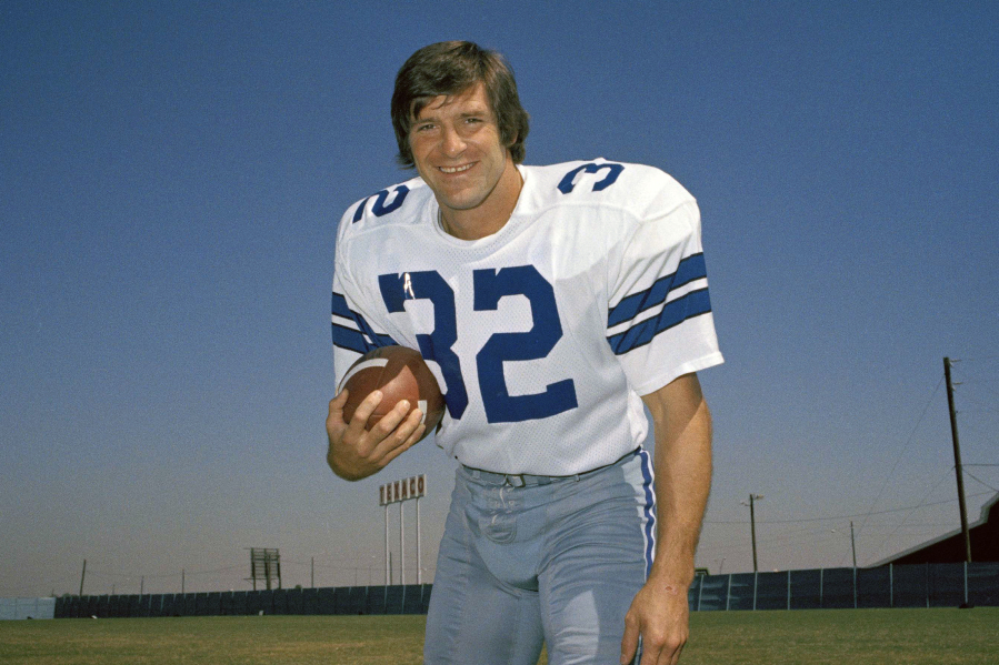 FILE - Walt Garrison, running back for the Dallas Cowboys, is shown in this 1974 photo. Walt Garrison, who led the Big 8 in rushing as an Oklahoma State Cowboy, won a Super Bowl with the Dallas Cowboys, and in the NFL offseason competed as a rodeo cowboy, has died. He was 79. The NFL team said in a story posted on its website Thursday, Oct. 12, 2023, that Garrison died overnight.