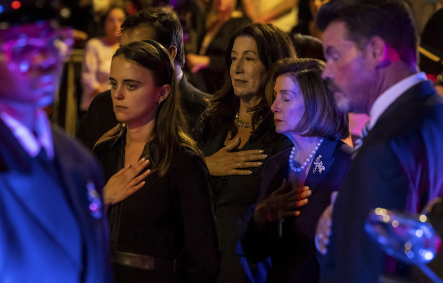 U.S. Representative Nancy Pelosi, second right, closes her eyes as she waits with her daughter, Christine Pelosi, rear, and Eileen Mariano, granddaughter of the late U.S. Senator Dianne Feinstein, left, for her casket to be taken to the funeral home following a day of lying in state at San Francisco City Hall, on Wednesday, Oct. 4, 2023.