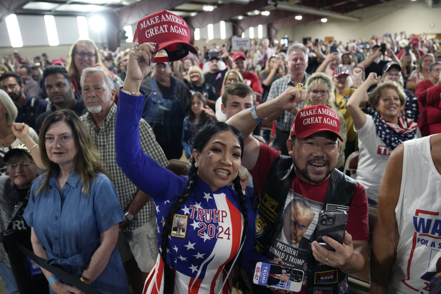 FILE - Supporters cheer for former President Donald Trump as he speaks during a commit to caucus rally, Wednesday, Sept. 20, 2023, in Maquoketa, Iowa. By the time he returns Monday, Oct. 16, to Iowa, Trump will have drawn more than 10,000 people to his events here in less than a month. There's no guarantee his crowds will translate to support in the state's Jan. 15 caucuses that will launch the 2024 nominating cycle. But unlike his campaign in 2016, Trump has a more sophisticated organization to capitalize on his high-wattage events.