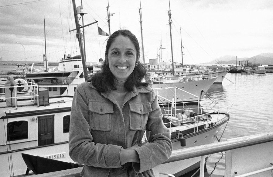FILE - U.S. folk singer Joan Baez, who wrote the ballad for the Italian film "Sacco e Vanzetti", is pictured by Cannes harbor, France, May 27, 1971.