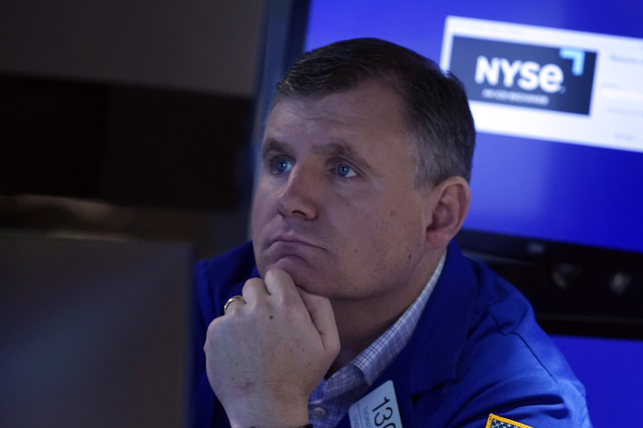 Specialist Thomas Schreck works at his post on the floor of the New York Stock Exchange, Tuesday, Oct. 3, 2023. Wall Street is sinking sharply as it focuses on the downside of a surprisingly strong job market.