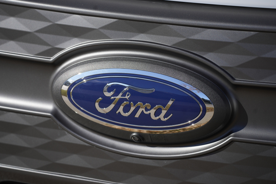 FILE - The Ford company logo is shown on Thursday, Nov. 25, 2022, outside a Ford dealership in southeast Denver.  Ford is recalling more than 238,000 Explorers in the U.S. because a rear axle bolt can fail, potentially causing a loss of drive power or allowing the SUVs to roll away while in park. The recall on Friday, Oct. 13, 2023, comes after U.S. safety regulators opened an investigation into the problem after getting two complaints that repairs didn't work in two previous recalls this year and in 2022.