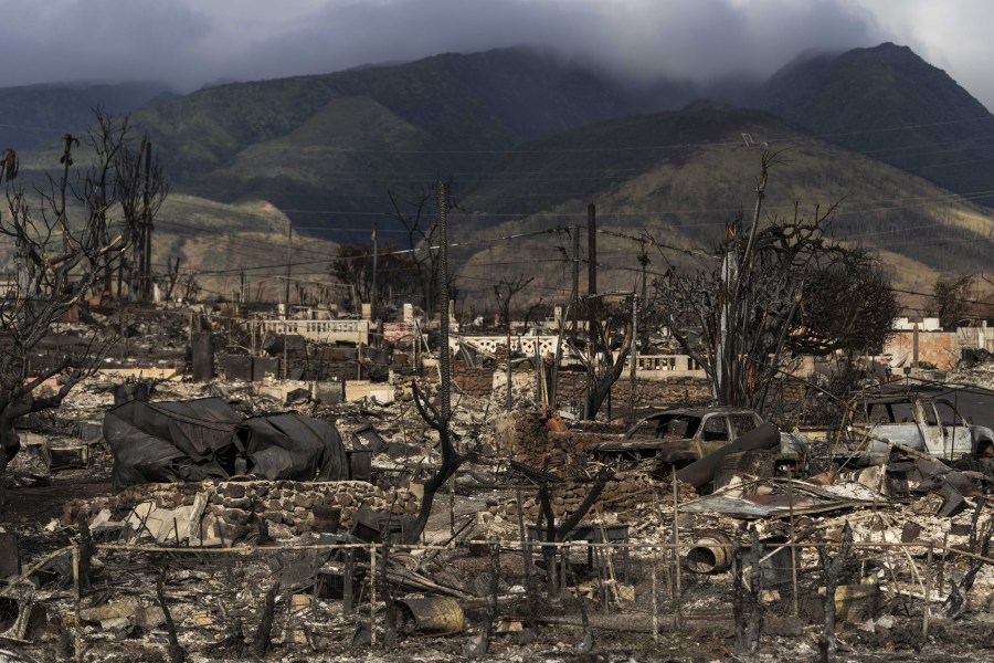 FILE - A general view shows the aftermath of a wildfire in Lahaina, Hawaii, Aug. 21, 2023. Federal authorities have started removing hazardous materials from the Maui wildfires and laying the groundwork to dispose of burnt cars, buildings and other debris. The hazardous materials, including oil, solvent and batteries, are being shipped to the West Coast while the U.S. Army Corps of Engineers works with local officials to develop a plan to dispose of an estimated 400,000 to 700,000 tons of debris on the island. (AP Photo/Jae C.