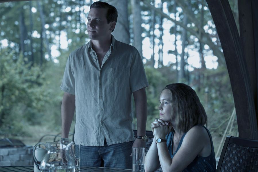 This image released by Netflix shows Michael Mosley, left, and Bethany Anne Lind in a scene from "Ozark."  (Jackson Davis/Netflix via AP)