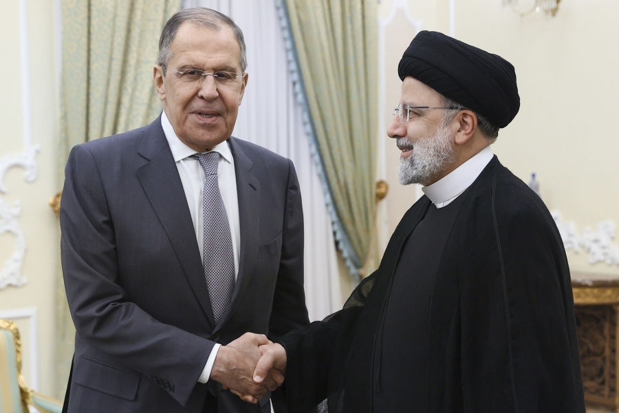 In this photo released by Russian Foreign Ministry Press Service, Russian Foreign Minister Sergey Lavrov, left, and Iranian President Ebrahim Raisi pose for a photo during their meeting in Tehran, Monday, Oct. 23, 2023. Lavrov is scheduled to meet with Turkish, Armenian and Azeri foreign ministers for a 3+3 meeting on the Caucasus region.