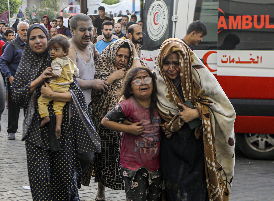 Wounded Palestinians arrive to al-Shifa hospital, following Israeli airstrikes on Gaza City, central Gaza Strip, Monday, Oct. 16, 2023.