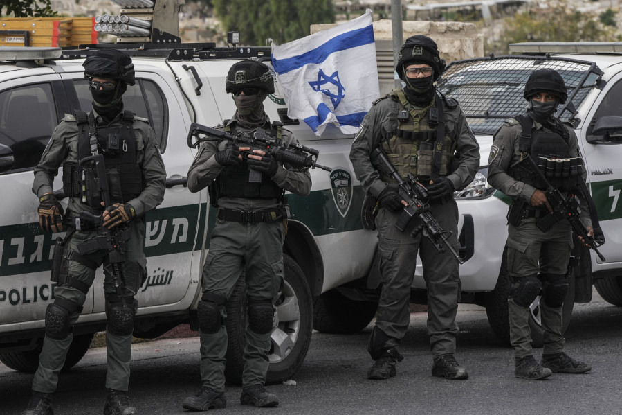 Israeli border police stand outside Jerusalem's Old City during Friday's prayers, Oct. 27, 2023.