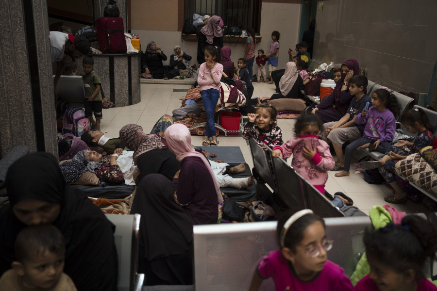 Palestinians take shelter in a hospital during ongoing Israeli bombardment in Khan Younis, Gaza Strip, Friday, Oct. 27, 2023.