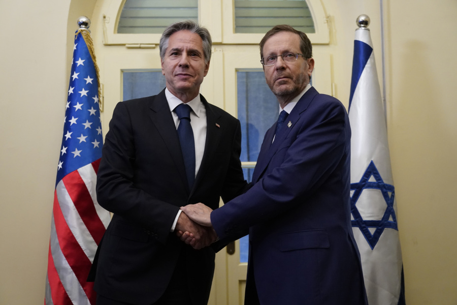 U.S. Secretary of State Antony Blinken, left, and Israel's President Isaac Herzog shake hands after their meeting in Tel Aviv, Thursday Oct. 12, 2023. President Joe Biden is dispatching his top diplomat to Israel on an urgent mission to show U.S. support after the unprecedented attack by Hamas militants.