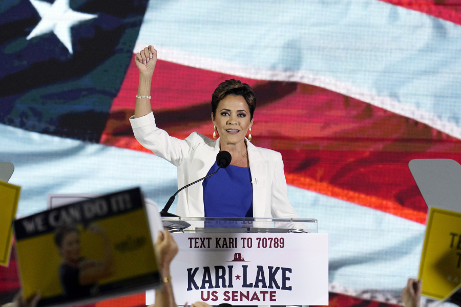 FILE - Republican Kari Lake waves to supporters as she announces her plans to run for the Arizona U.S. Senate seat during a rally, Tuesday, Oct. 10, 2023, in Scottsdale, Ariz. On Monday, Oct. 16, a federal appeals court tossed out a lawsuit brought by former Arizona gubernatorial candidate Lake that was previously dismissed, challenging use of electronic voting machines and sought to ban them in last year's midterm elections. (AP Photo/Ross D.