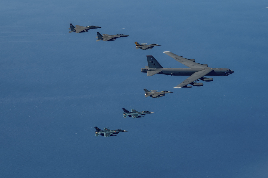 In this photo provided by the U.S. Air Force via South Korea Defense Ministry, a U.S. Air Force B-52H bomber, center, F-16 fighter jets, South Korean Air Force F-15K fighter jets, left top, and Japanese Air Force F-2 fighter jets, left bottom, fly in formation during a joint air drill near Korean Peninsula on Sunday, Oct. 22, 2023. The South Korean, U.S. and Japanese militaries conducted their first-ever trilateral aerial exercise on Sunday in response to evolving North Korean nuclear threats, South Korea's air force said. (The U.S.