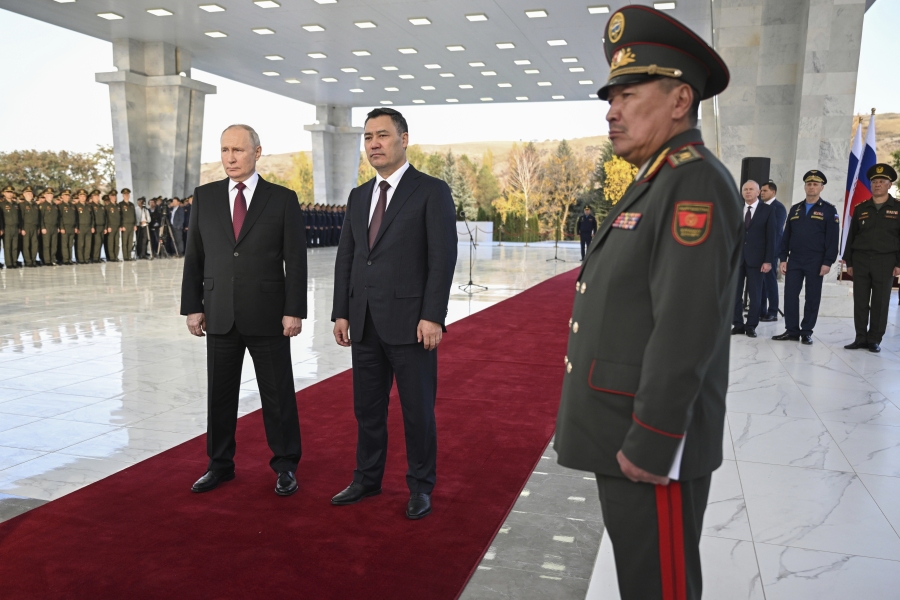 Russian President Vladimir Putin, left, and Kyrgyzstan's President Sadyr Japarov attend an event dedicated to the 20th anniversary of the establishment of the Russian military base in the city of Kant outside Bishkek, Kyrgyzstan, Thursday, Oct. 12, 2023.