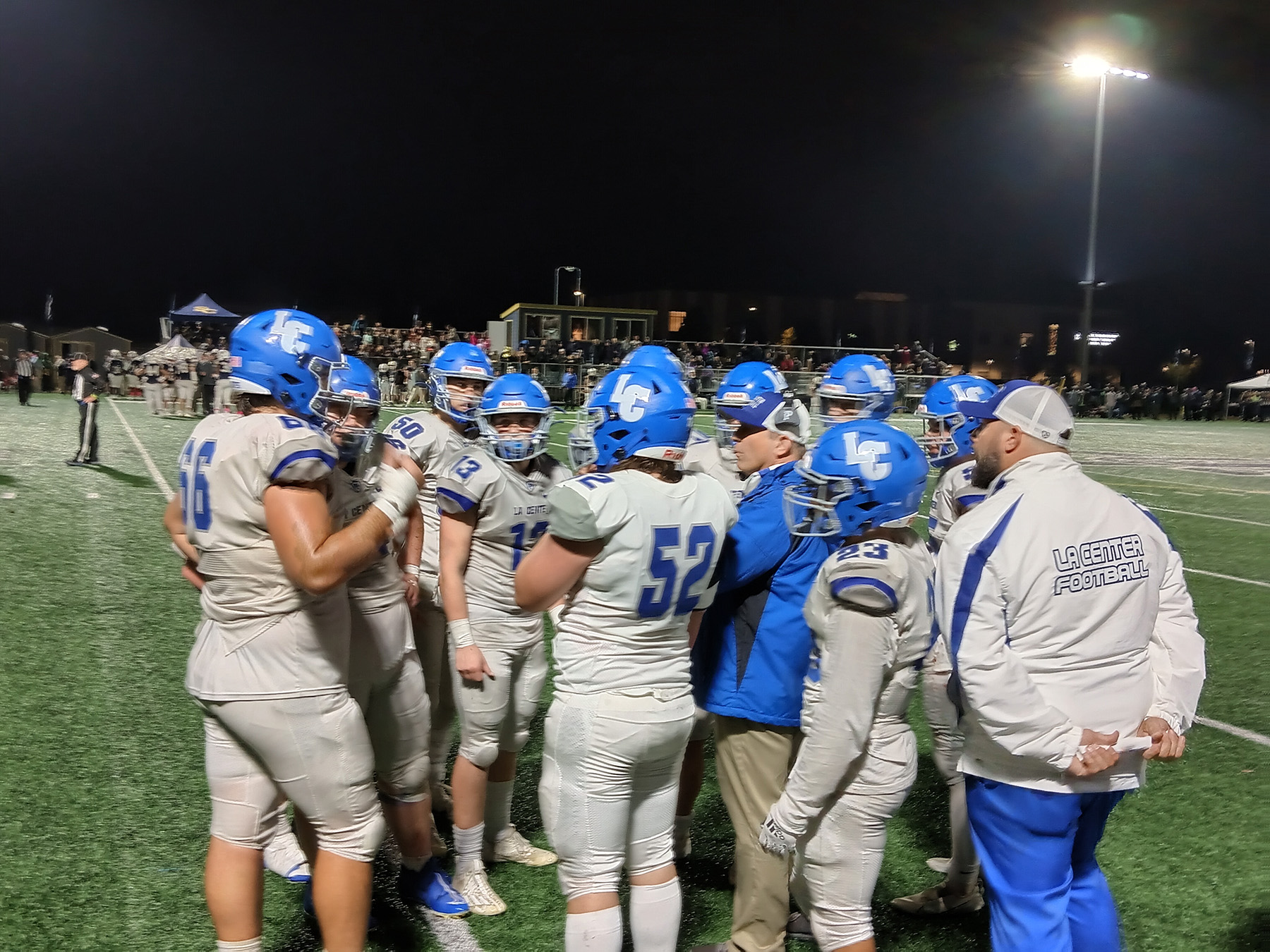 La Center coach John Lambert discussed strategy with his players during a timeout late in the Wildcats' 14-13 win over Seton Catholic (Tim Martinez/The Columbian)