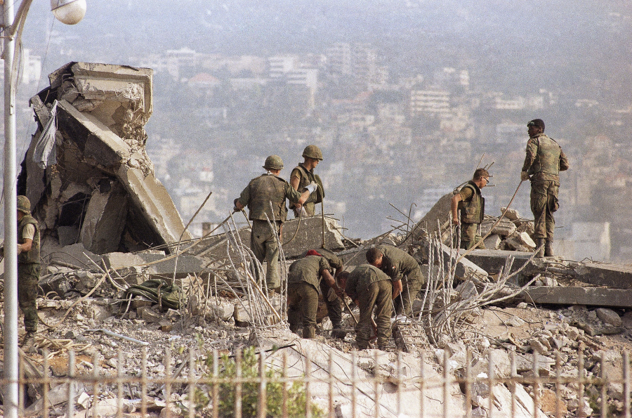 File - This is the scene around the U.S. Marine Base near Beirut Airport following a massive bomb blast that destroyed the base and caused a huge death, Oct. 23, 1983. Forty years after one of the deadliest attacks against U.S. troops in the Middle East, some warn that Washington could be sliding toward a new conflict in the region.