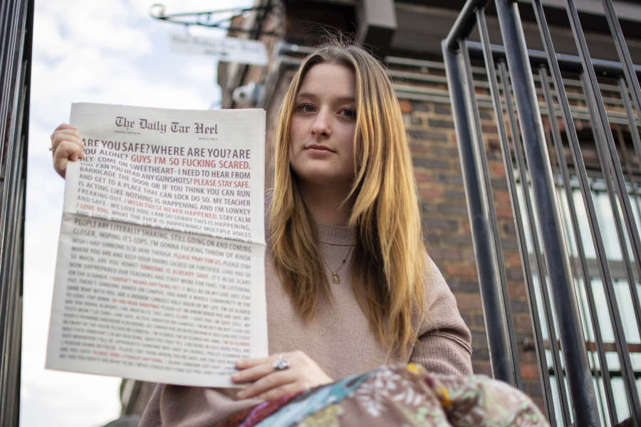 Emmy Martin, Editor in Chief of The Daily Tar Heel, the student newspaper of the University of North Carolina at Chapel Hill, poses with a copy of the Aug. 30 paper outside of the newsroom on Monday, Oct. 9, 2023, in Chapel Hill, N.C.