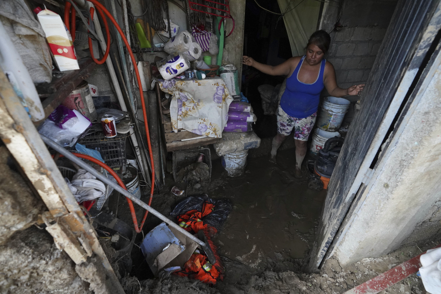 Elizabeth Morales show the damaged to her home after Hurricane Otis ripped through Acapulco, Mexico, Thursday, Oct. 26, 2023. The hurricane that strengthened swiftly before slamming into the coast early Wednesday as a Category 5 storm has killed at least 27 people as it devastated Mexico's resort city of Acapulco.