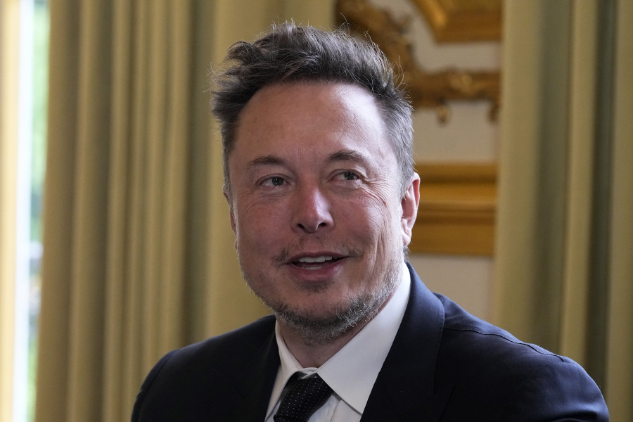 FILE - Twitter, now X. Corp., and Tesla CEO Elon Musk poses before his talks with French President Emmanuel Macron, May 15, 2023, at the Elysee Palace in Paris. The Securities and Exchange Commission said Thursday, Oct. 5, that it is seeking a court order that would compel Musk to testify as part of an investigation into his purchase of Twitter, now called X.