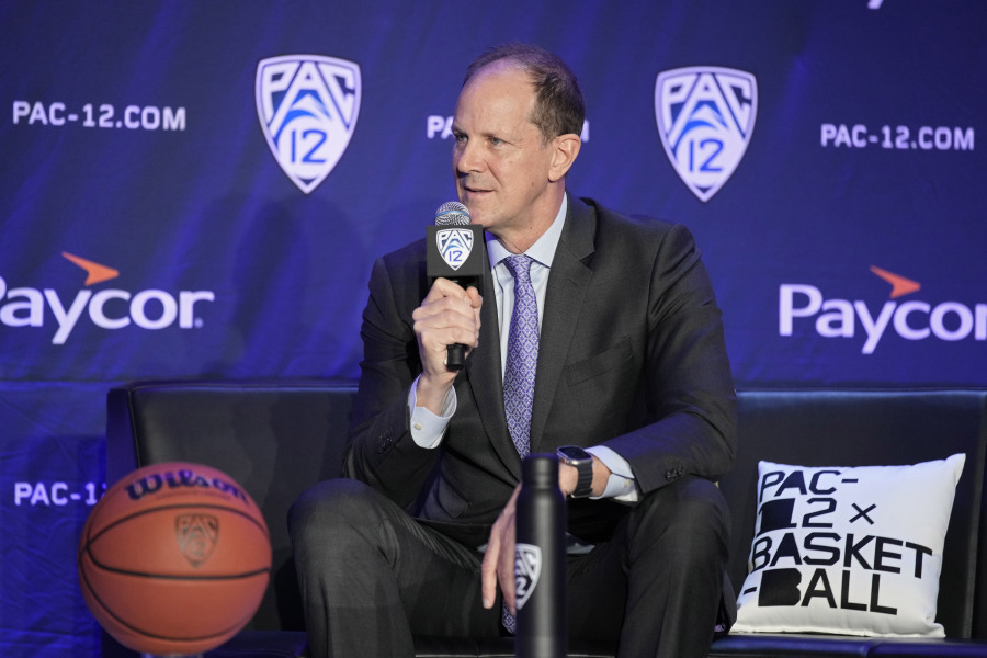 Washington head coach Mike Hopkins speaks during a news conference at the Pac-12 Conference NCAA college basketball media day Wednesday, Oct. 11, 2023, in Las Vegas.