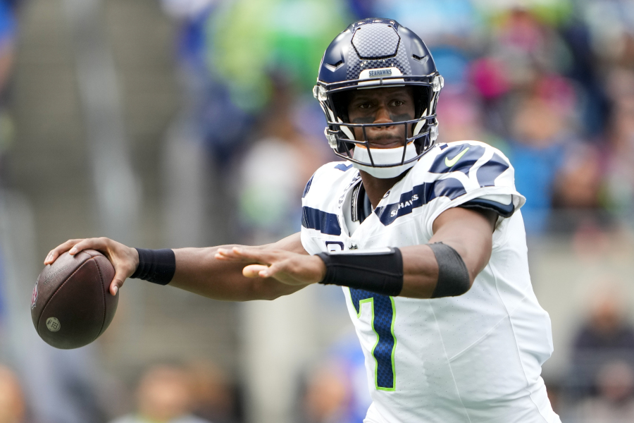 Seattle Seahawks quarterback Geno Smith passes against the Carolina Panthers during the first half of an NFL football game Sunday, Sept. 24, 2023, in Seattle.