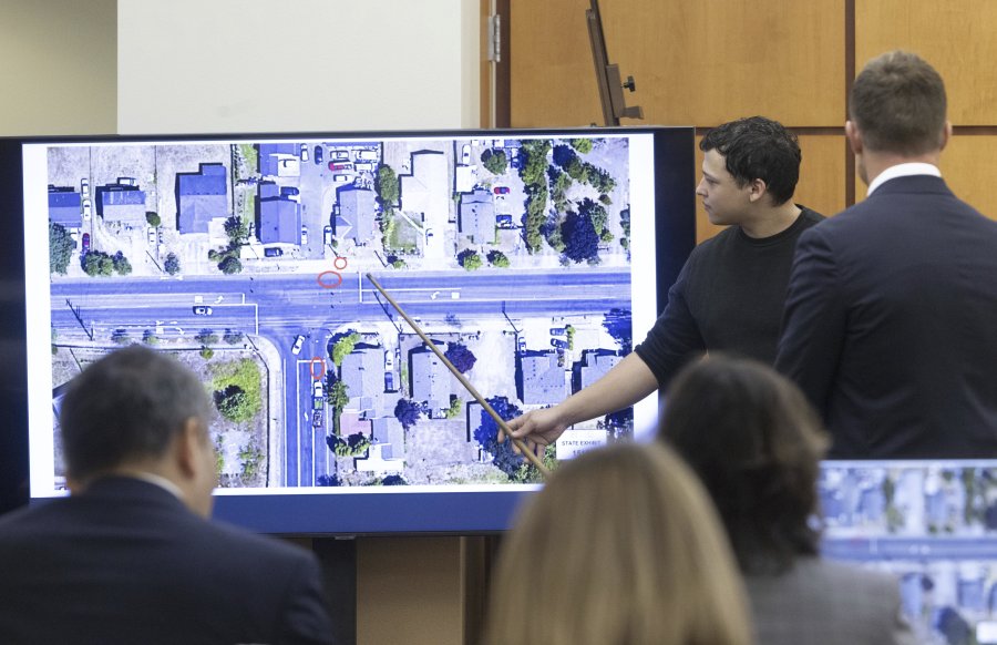 Witness Seth Cowden, who filmed a video of the beating and killing of Manny Ellis, points to where he says a Tacoma police officer's car was parked in an aerial view of the scene in Pierce County Superior Court Wednesday, Oct. 18, 2023, in Tacoma, Wash. Tacoma Police Officers Christopher Burbank, Matthew Collins and Timothy Rankine are on trial for the killing of Manny Ellis on March 3, 2020.. (Ellen M.