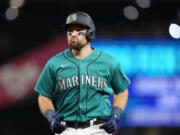 Seattle Mariners' Cal Raleigh reacts after flying out against the Texas Rangers during the eighth inning of a baseball game, Saturday, Sept. 30, 2023, in Seattle.