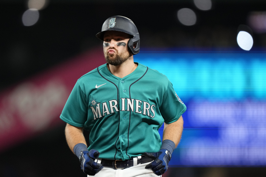 Seattle Mariners' Cal Raleigh reacts after flying out against the Texas Rangers during the eighth inning of a baseball game, Saturday, Sept. 30, 2023, in Seattle.