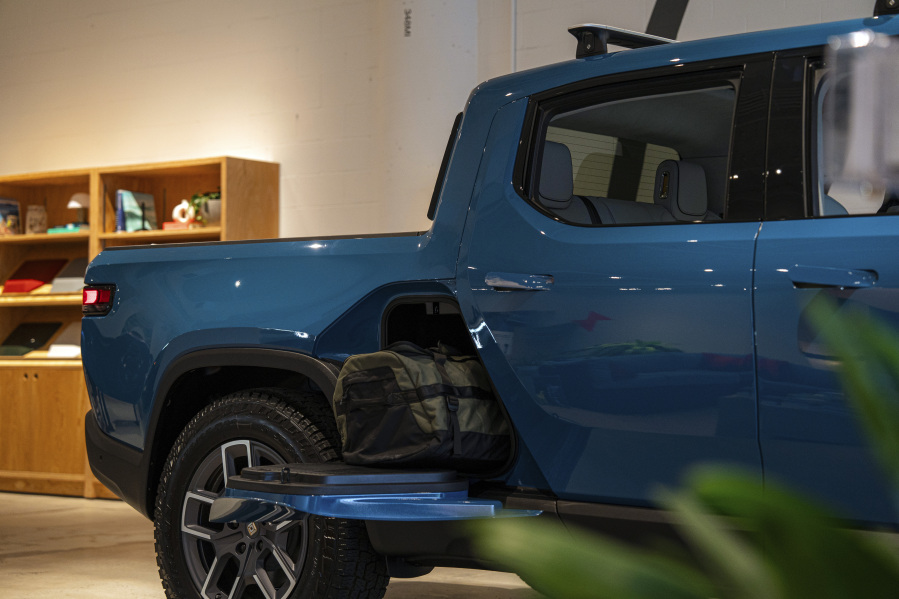 A Rivian R1S is displayed inside of the auto manufacturer's new space at Ponce City Market on Thursday, Oct. 19, 2023 in Atlanta. Rivian Automotive will move ahead with construction on a factory in Georgia early next year, the company confirmed Thursday.