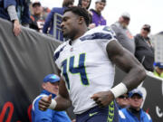 Seattle Seahawks wide receiver DK Metcalf (14) jogs to the tunnel during an NFL football game against the Cincinnati Bengals, Sunday, Oct. 15, 2023, in Cincinnati.