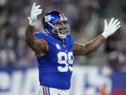 New York Giants defensive end Leonard Williams (99) reacts against the Seattle Seahawks during the second quarter of an NFL football game, Monday, Oct. 2, 2023, in East Rutherford, N.J.