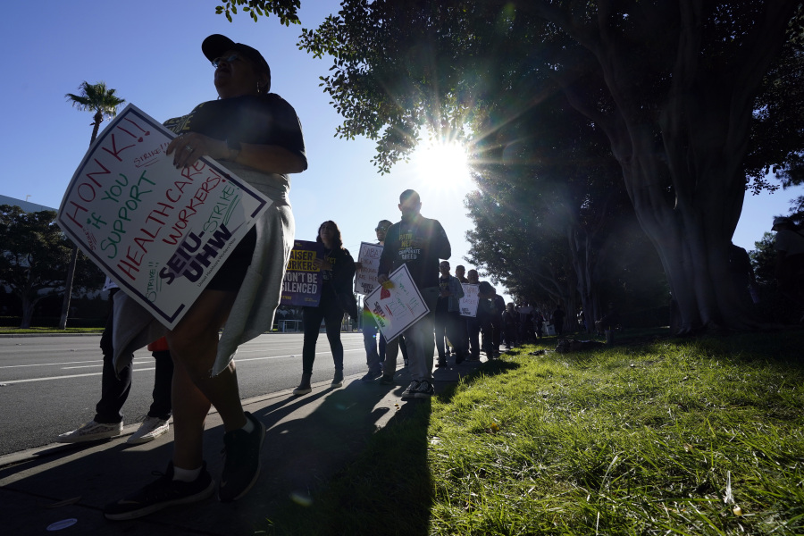 File - Kaiser Permanente workers picket during a three-day health care strike on Oct. 4, 2023, in Irvine, Calif. From auto production lines to Hollywood, the power of labor unions is back in the national spotlight.