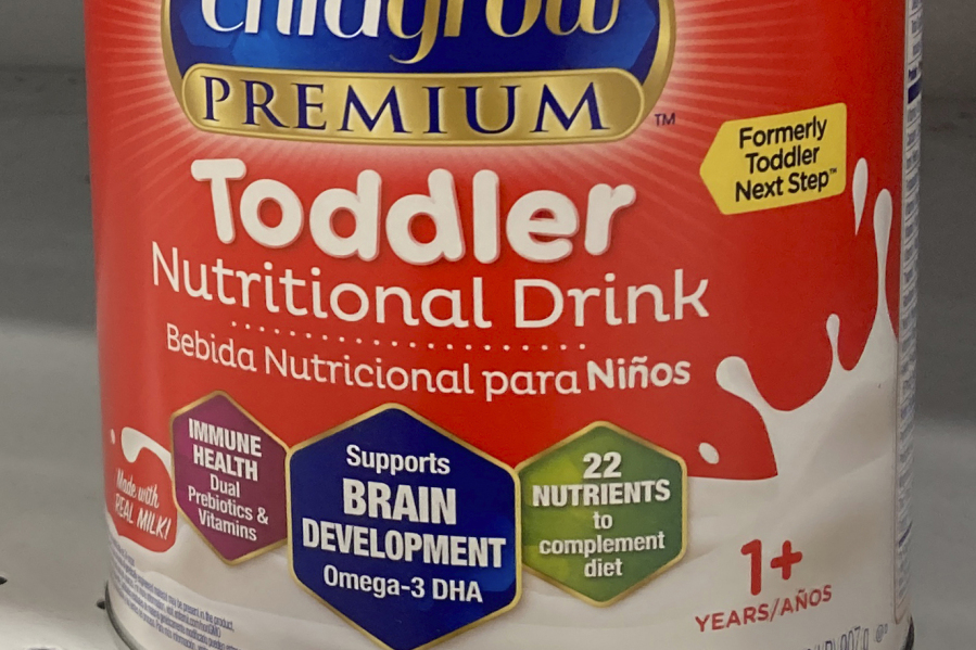 FILE - A can of toddler nutritional drink sits on a shelf in a grocery store in Surfside, Fla., on Friday, June 17, 2022. Powdered drink mixes that are widely promoted as "toddler milks" for older babies and children up to age 3 are unregulated, unnecessary and "nutritionally incomplete," the American Academy of Pediatrics warned Friday, Oct.