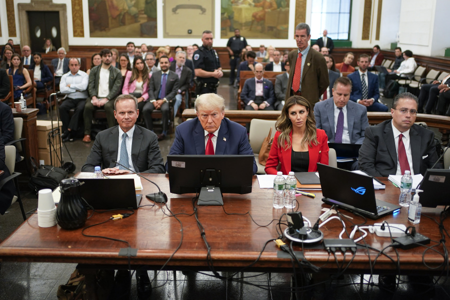 Former President Donald Trump, center, sits in the courtroom with is legal team before the continuation of his civil business fraud trial at New York Supreme Court, Tuesday, Oct. 3, 2023, in New York.
