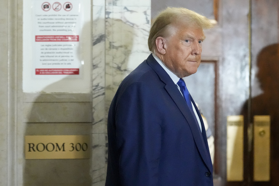 Former President Donald Trump returns to the courtroom after a break in his civil business fraud trial at New York Supreme Court, Wednesday, Oct. 25, 2023, in New York. The judge in Donald Trump's civil fraud trial has fined the former president $10,000.
