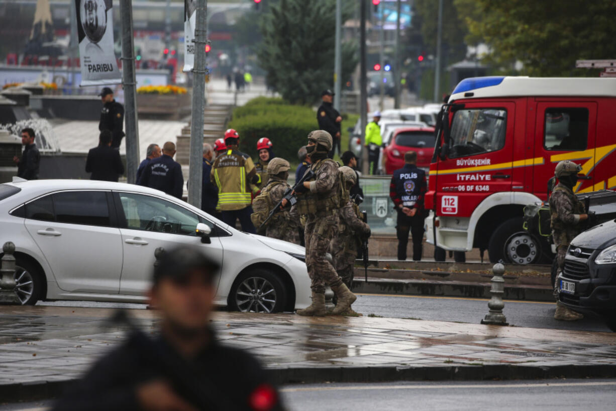 Turkish security forces cordon off an area after an explosion in Ankara, Sunday, Oct. 1, 2023. A suicide bomber detonated an explosive device in the heart of the Turkish capital, Ankara, on Sunday, hours before parliament was scheduled to reopen after a summer recess. A second assailant was killed in a shootout with police.