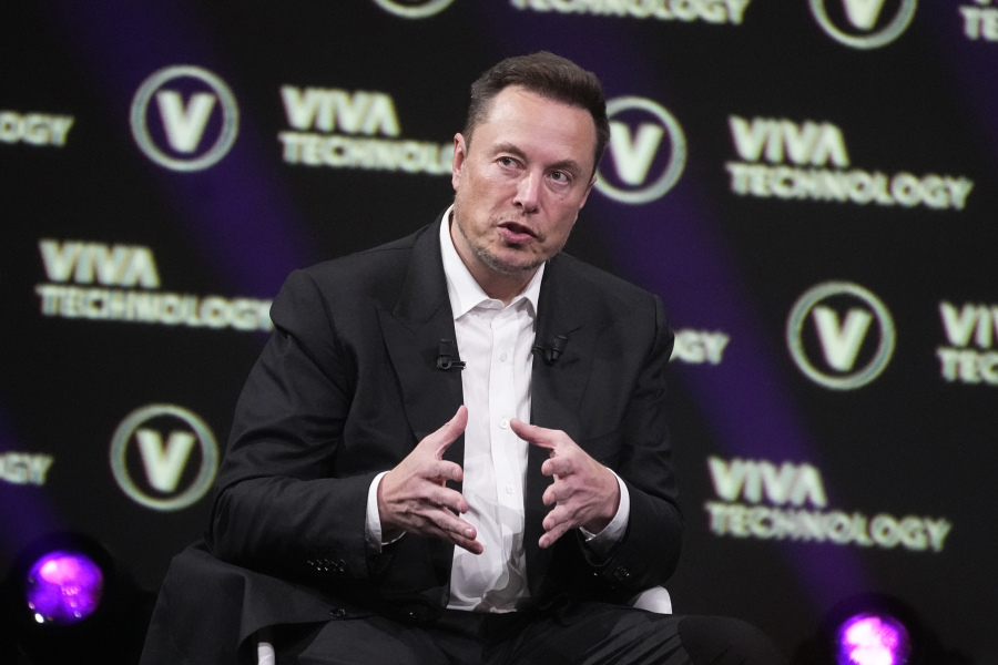 FILE - Elon Musk, who owns Twitter, Tesla and SpaceX, speaks at the Vivatech fair, in Paris, France, Friday, June 16, 2023. The head of Elon Musk's social media platform X says the company formerly known has Twitter has removed hundreds of Hamas-linked accounts and taken down or labeled thousands of pieces of content since the militant group's attack on Israel.