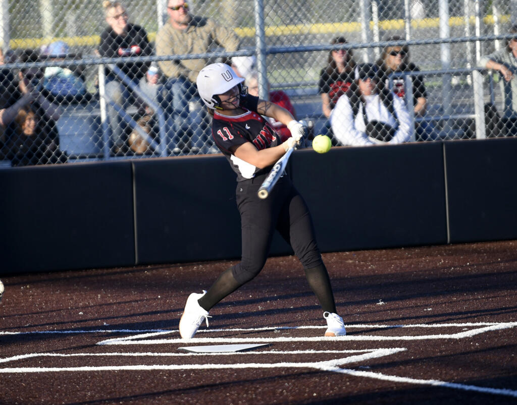 Union's Sophia Rickard connects on a pitch during the Titans' 15-11 win over Skyview in the 4A district slowpitch softball championship game at Heritage High School on Thursday, Oct. 19, 2023.