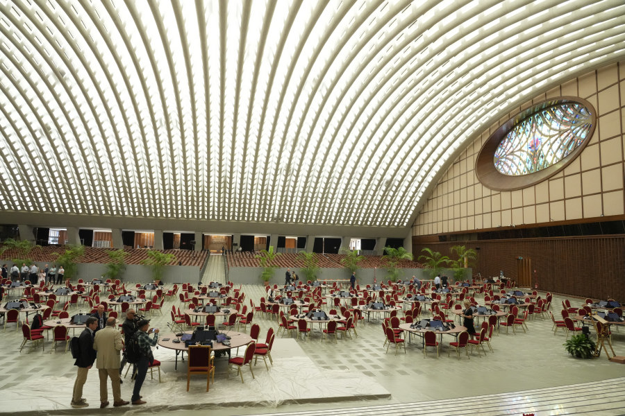The workspace for the the synod of bishops starting on Oct. 4, 2023, is set up inside the Paul VI Hall at The Vatican, Tuesday, Oct. 3, 2023. Pope Francis is opening a global gathering of bishops and laypeople to discuss the future of the Catholic Church, including some hot-button issues that have previously been considered off-limits for discussion. For the first time, women and laypeople can vote on specific proposals alongside bishops, a radical change that is evidence of Francis' belief that the church is more about its flock than its shepherds.