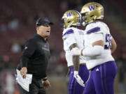 Washington coach Kalen DeBoer, left, reacts toward players after Washington stopped Stanford on a 2-point conversion attempt during the second half of an NCAA college football game in Stanford, Calif., Saturday, Oct. 28, 2023.