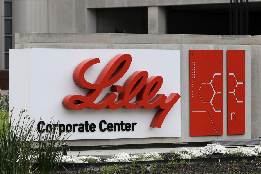 FILE - A sign for Eli Lilly & Co. stands outside their corporate headquarters in Indianapolis on April 26, 2017.  A new study finds that the medicine in the diabetes drug Mounjaro helped people with obesity or who are overweight lose at least a quarter of their body weight.