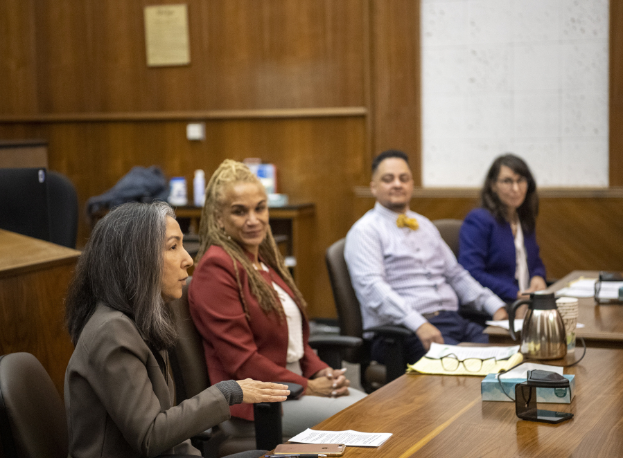 U.S. Magistrate Judge Youlee Yim You, left, talks to a group of students Thursday during the Color of Justice program at the Clark County Courthouse. The program, which started this year, invited middle school students to listen to a diverse panel of attorneys and judges speak about their legal careers.