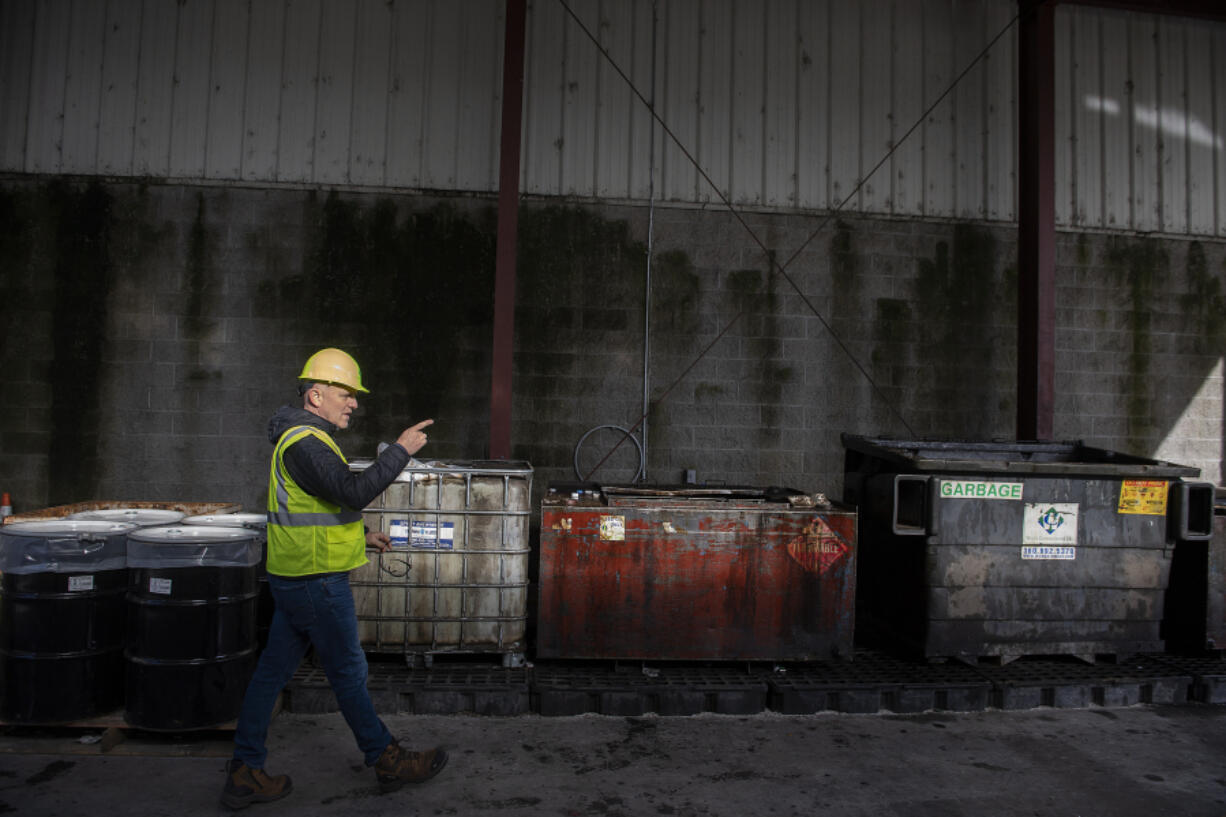 Derek Ranta, Waste Connections district manager, walks through the curbside oil area at West Van Materials Recovery Center on Monday afternoon.
