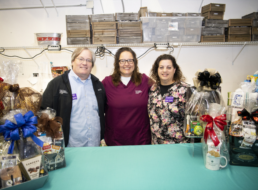 Operations manager, Steve Kuyatt, from left, owner Tangee Summerhill-Bishop, and delivery ambassador Cherilyn Klotzer are the team that make up the leadership behind Happy Baskets, a Vancouver-based gift basket business.
