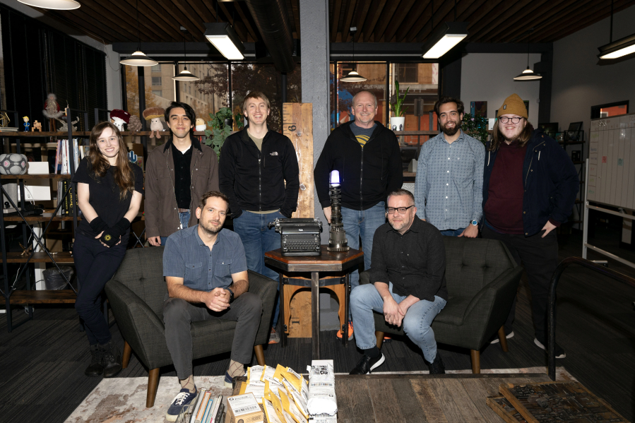 The Orange Nebula team poses for a photo in their downtown Vancouver office. The company has garnered a strong reputation among board game lovers, as the industry continues to grow worldwide.
