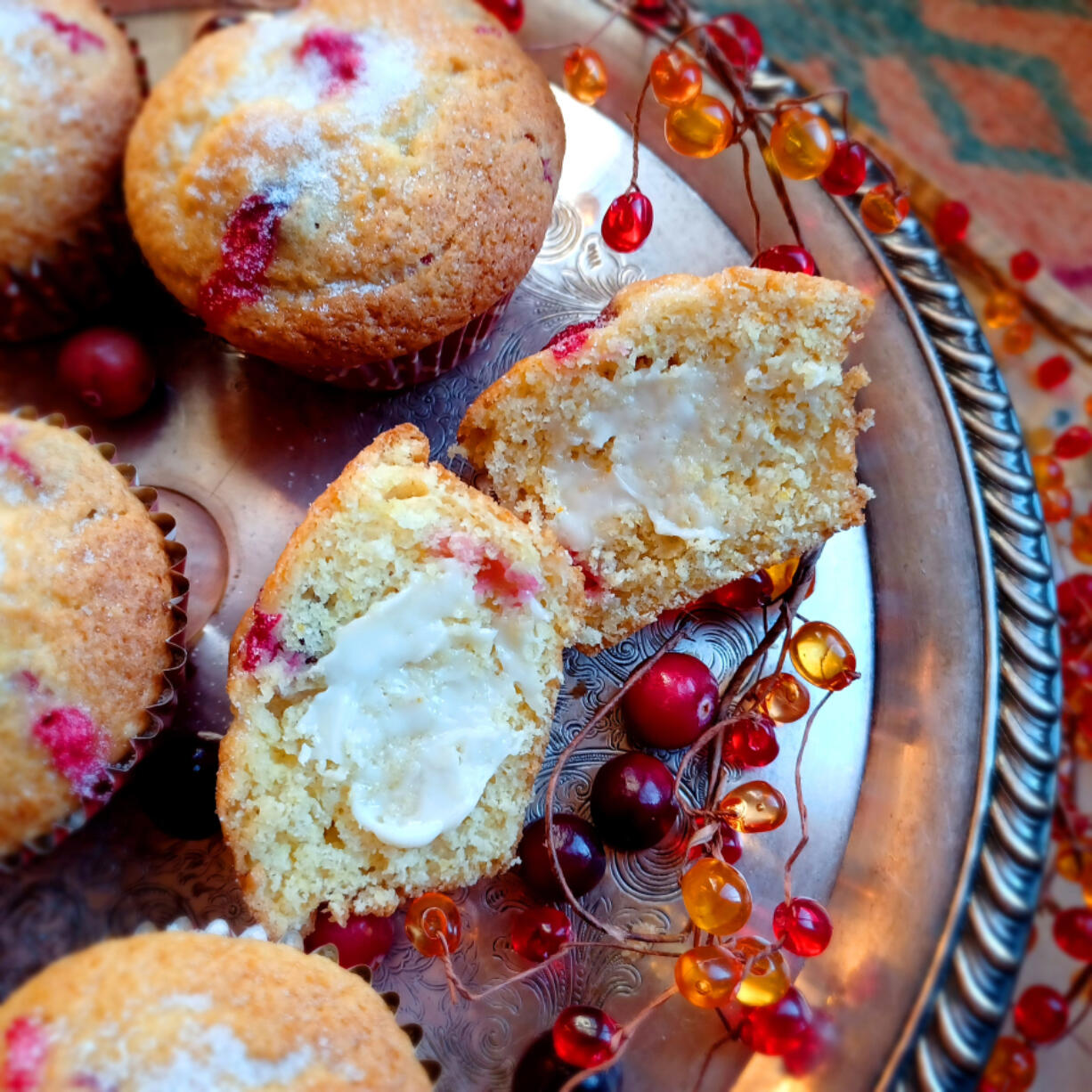 These pretty muffins have whole fresh cranberries, fresh squeezed orange juice and a little eggnog.