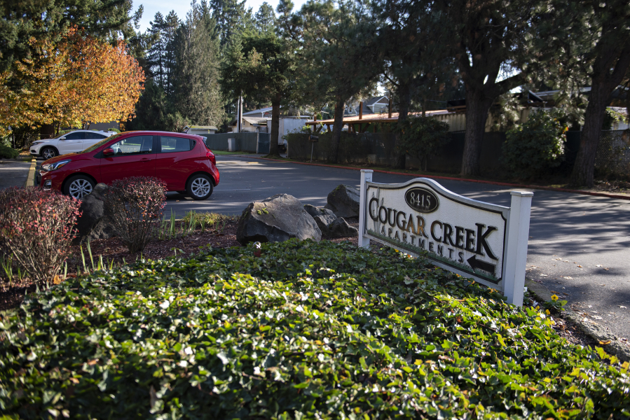 The sign for Cougar Creek Apartments is pictured in Hazel Dell.