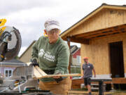 Volunteers work on a house at Evergreen Habitat for Humanity&rsquo;s Johnson Village subdivision in east Vancouver.