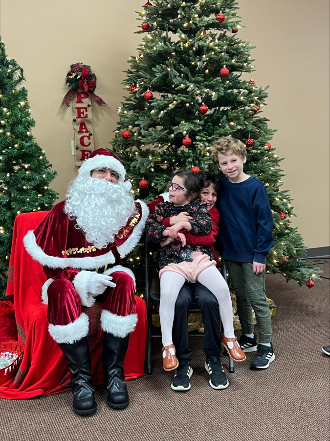 Stacy Abdollmohammadi&rsquo;s children visit with Santa Claus at Special Celebration&rsquo;s Sensitive Santa event last year.