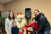 Stacy Abdollmohammadi poses with her family and a llama at Special Celebration&rsquo;s Sensitive Santa event, which her family has attend for four years.