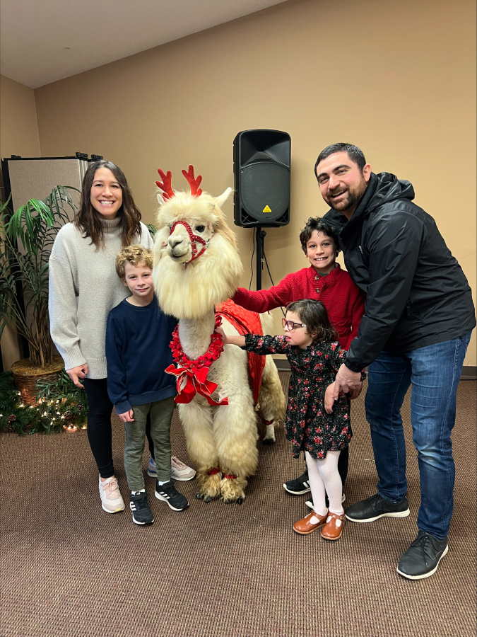 Stacy Abdollmohammadi poses with her family and a llama at Special Celebration&rsquo;s Sensitive Santa event, which her family has attend for four years.