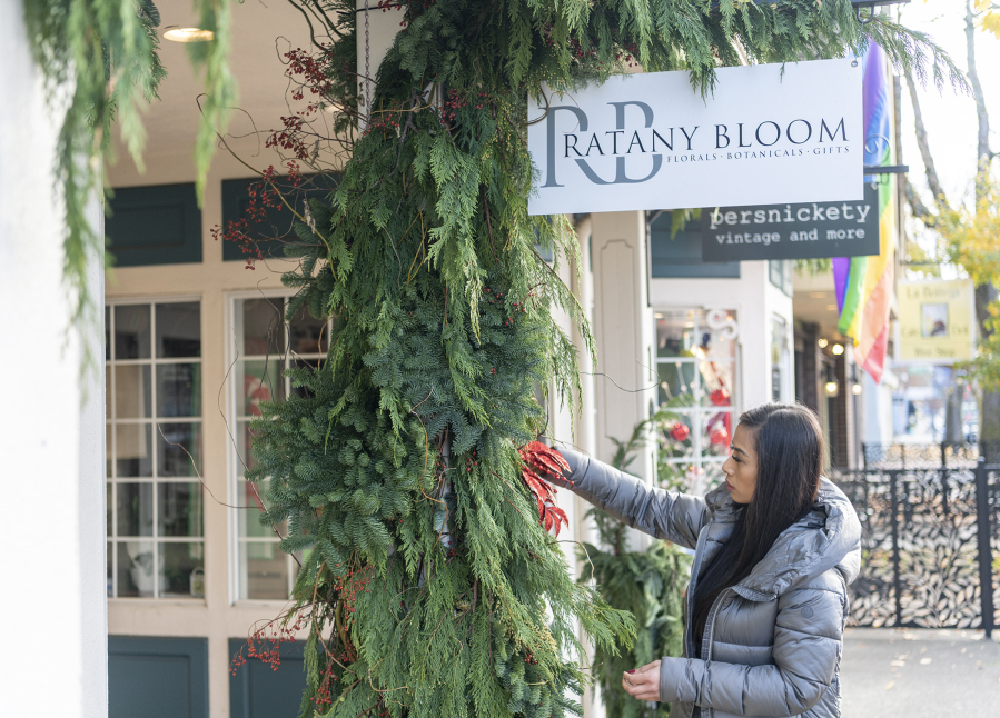 Owner Ratany Ouk decorates the exterior of her shop Ratany Bloom at 1911 Main St. in Vancouver&rsquo;s Uptown Village. A recent survey shows three quarters of small retailers rely heavily on holiday shoppers.